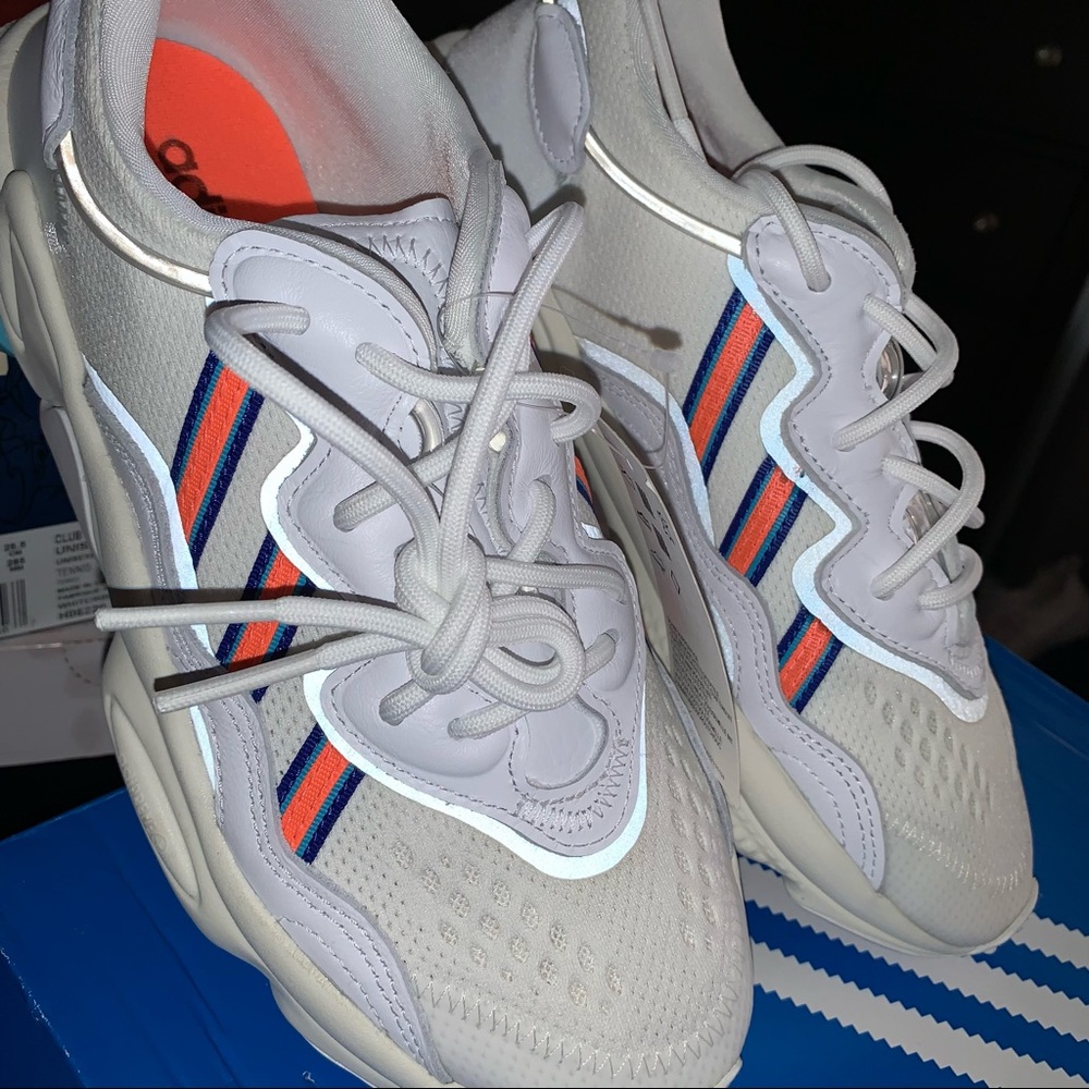 OZWEEGO size 7.5 womens sneakers! White with orange and indigo blue stripes.